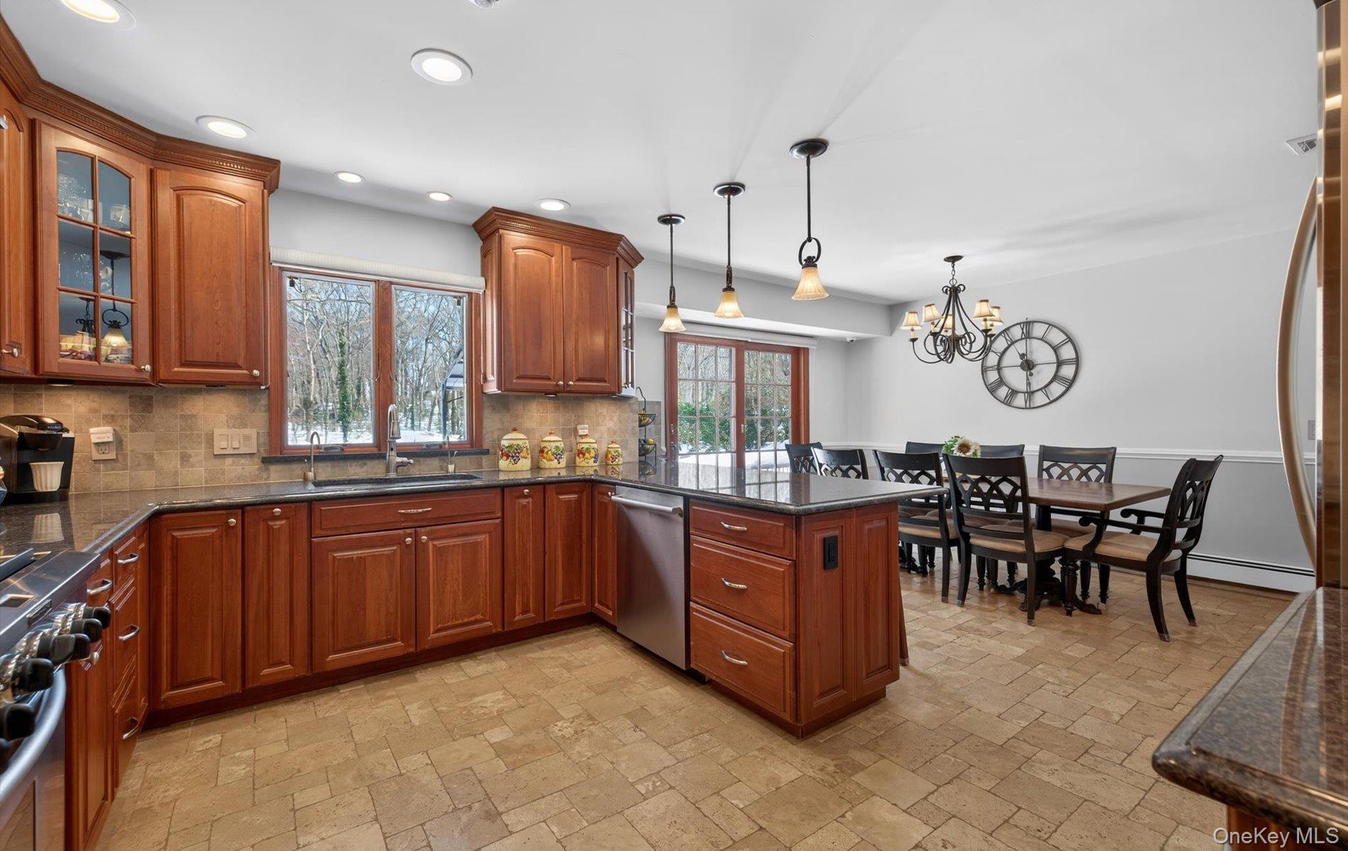15 Tiber Road Syosset, NY 11791 - Photo 11 of 46 a large kitchen with cabinets chairs and stainless steel appliances