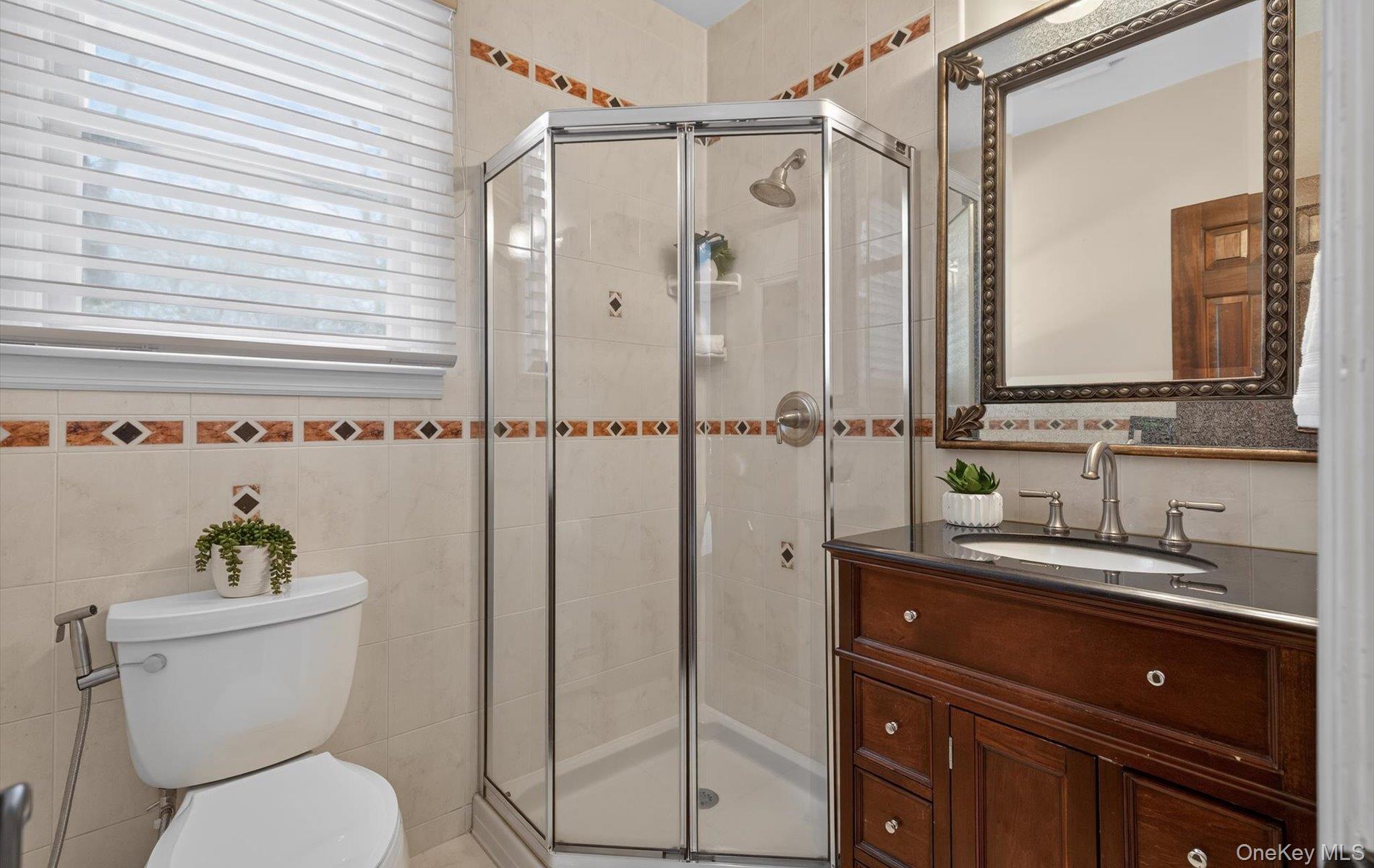 15 Tiber Road Syosset, NY 11791 - Photo 19 of 46 a bathroom with a toilet sink and shower
