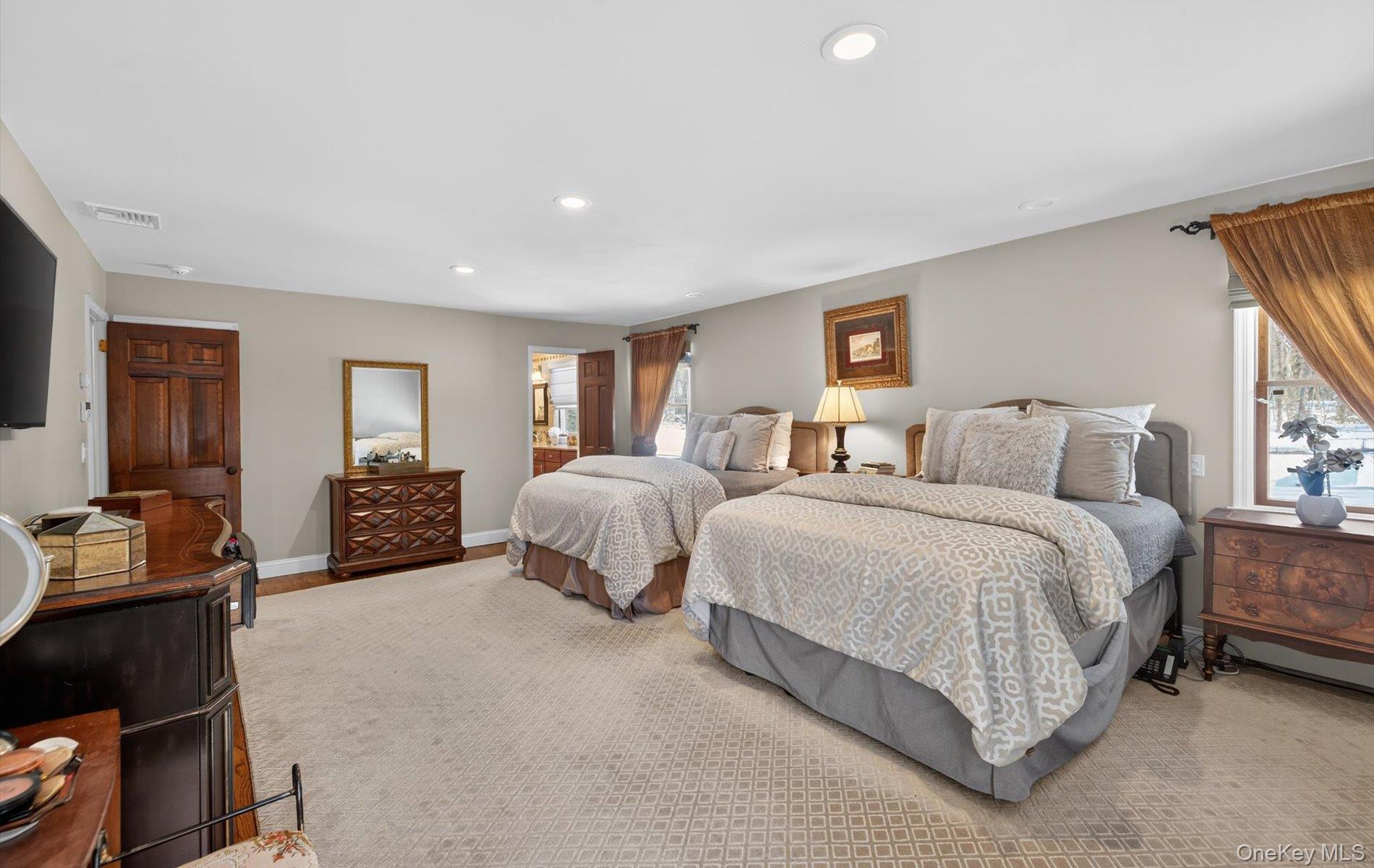 15 Tiber Road Syosset, NY 11791 - Photo 21 of 46 a spacious bedroom with double bed and a window