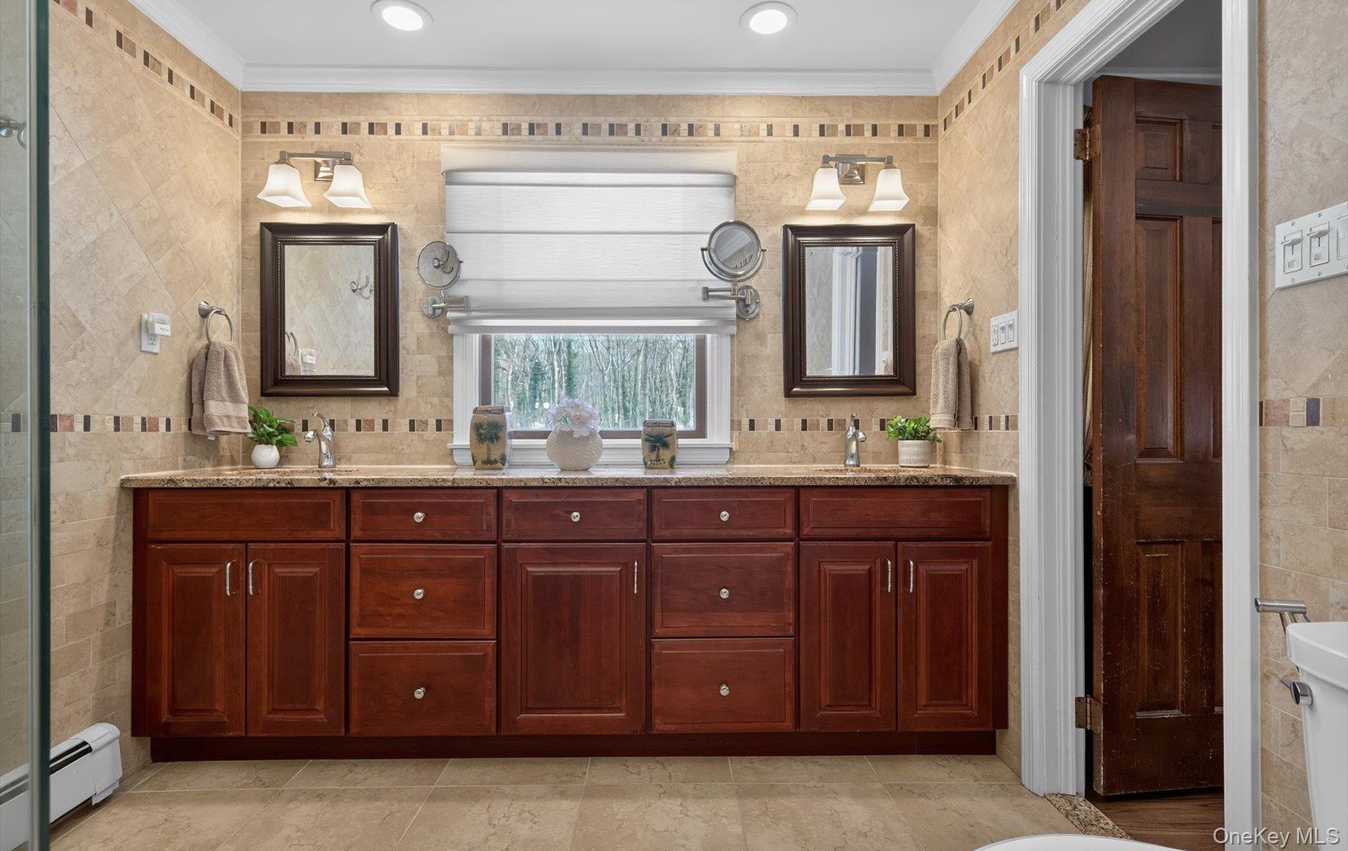 15 Tiber Road Syosset, NY 11791 - Photo 23 of 46 a bathroom with a granite countertop double vanity sink and a mirror