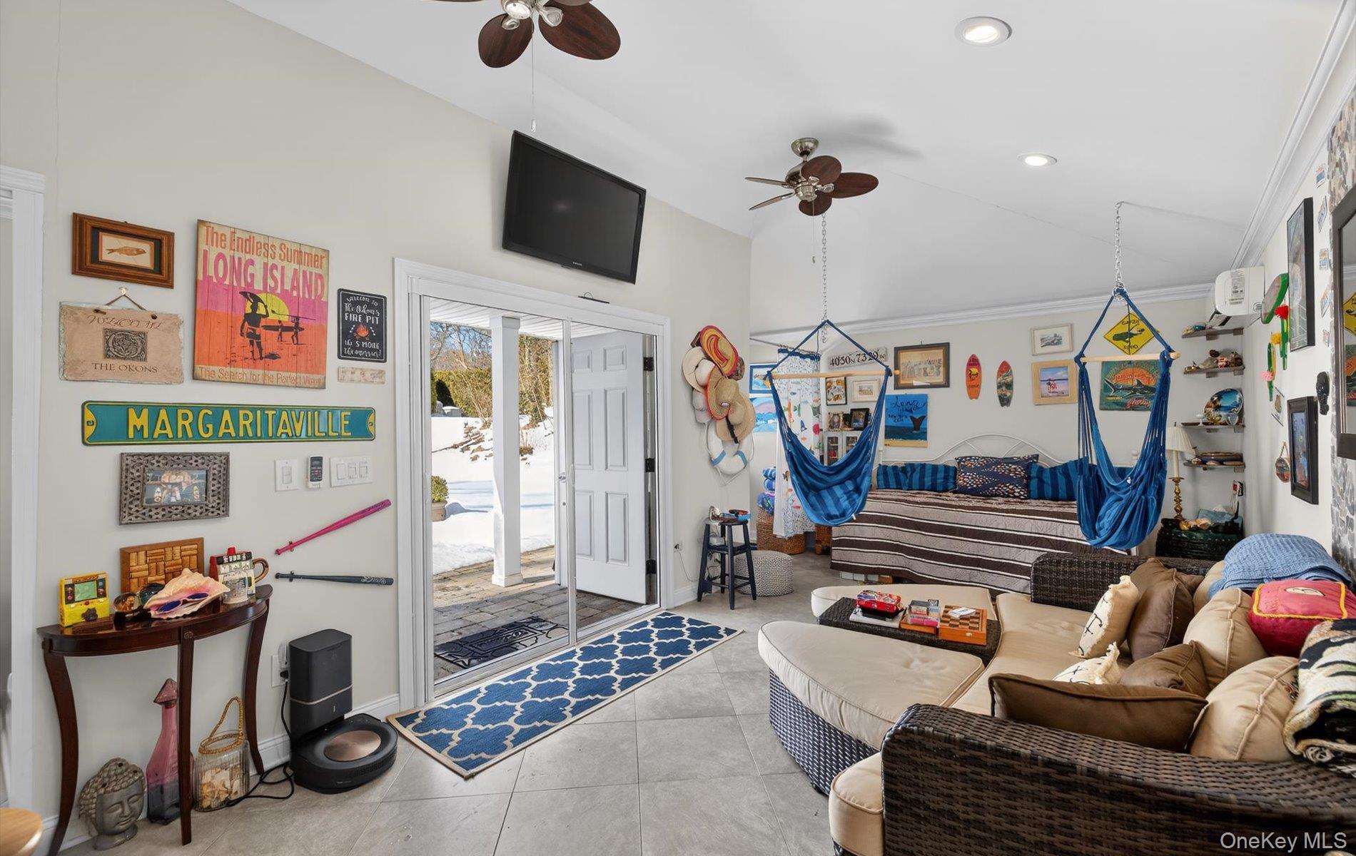 15 Tiber Road Syosset, NY 11791 - Photo 35 of 46 a view of a livingroom with furniture and a flat screen tv