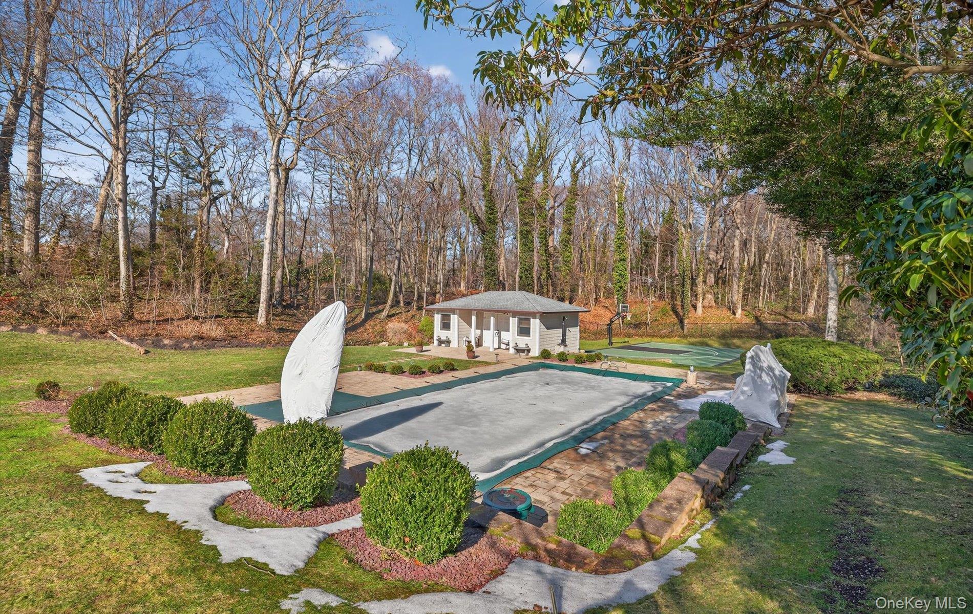 15 Tiber Road Syosset, NY 11791 - Photo 37 of 46 a view of a swimming pool with a patio
