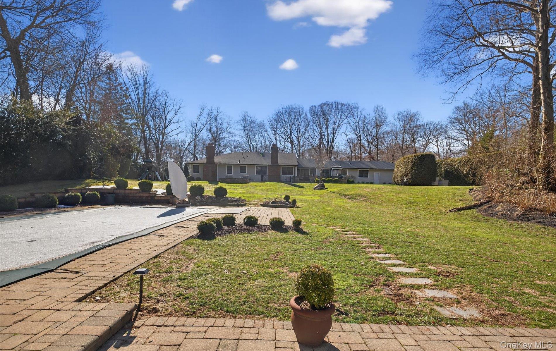 15 Tiber Road Syosset, NY 11791 - Photo 41 of 46 a view of a swimming pool with a patio