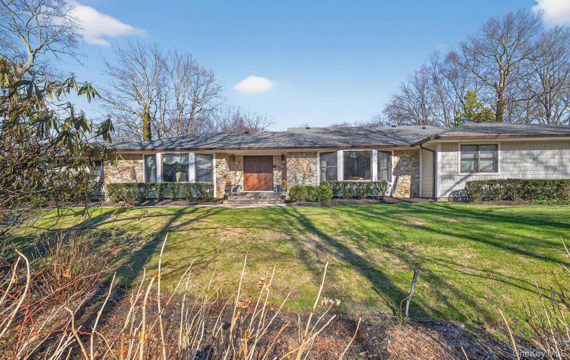 15 Tiber Road Syosset, NY 11791 - Photo 46 of 46 a view of a house with a big yard and potted plants and large trees