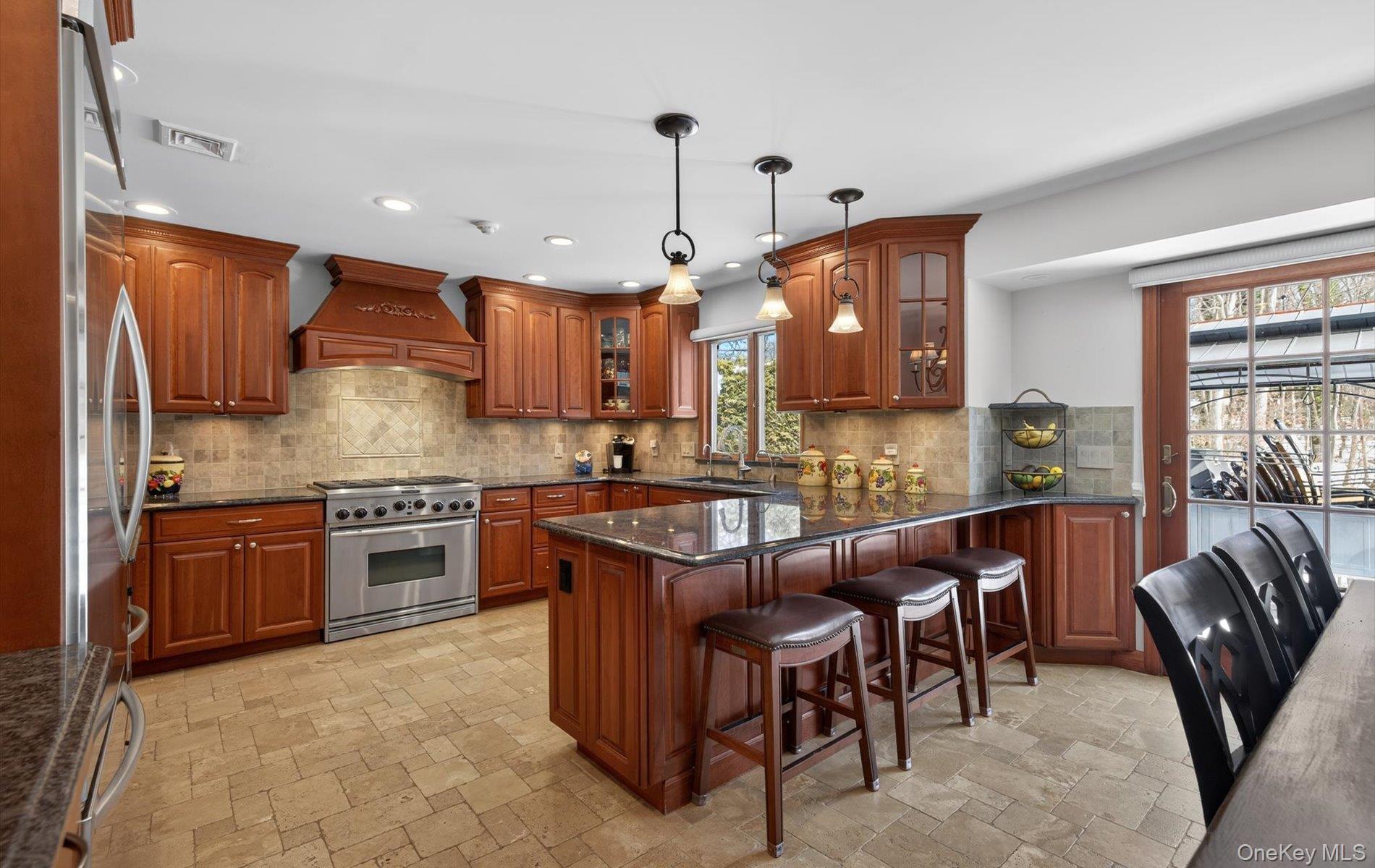 15 Tiber Road Syosset, NY 11791 - Photo 9 of 46 a kitchen with stainless steel appliances granite countertop wooden cabinets a stove top oven a sink and dishwasher