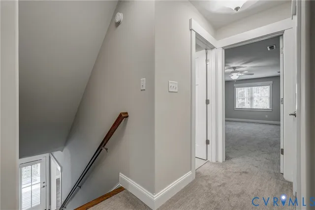 a bathroom with a granite countertop toilet a sink and a mirror
