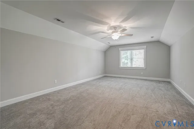 an aerial view of a house with yard