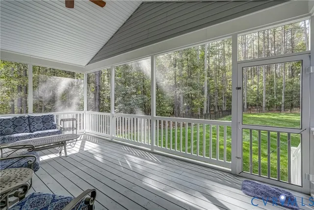 a view of a room with wooden floor and outdoor space