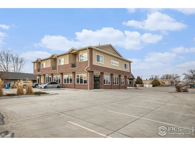 a view of a big house with many windows