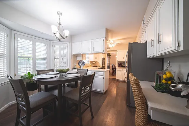 a view of a dining room with furniture window and outside view