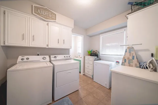 a utility room with dryer and washer