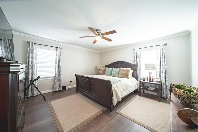 a bedroom with bed and window