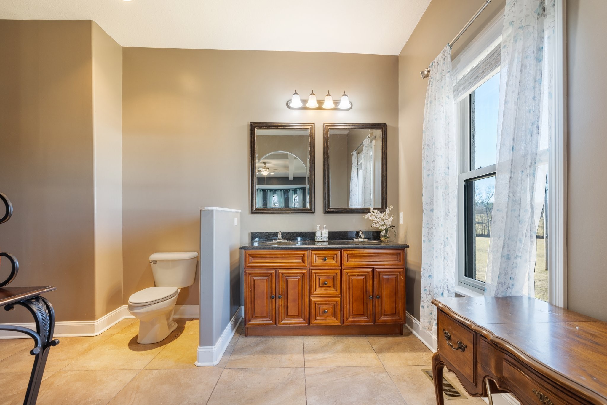 4785 Pulliam-Hardaway Road Springfield, TN 37172 - Photo 15 of 67 a bathroom with a toilet a sink and a mirror