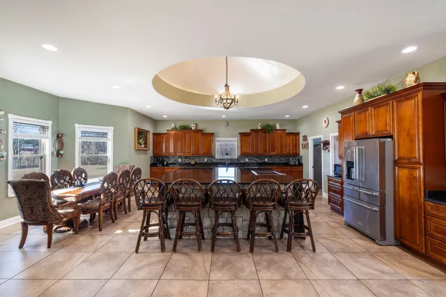 a kitchen with stainless steel appliances granite countertop a stove and a sink