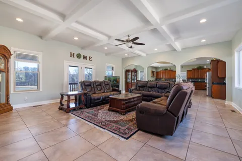 a bedroom with a bed a couch and dresser