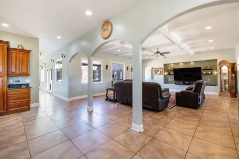 a bathroom with a granite countertop sink a mirror and a shower