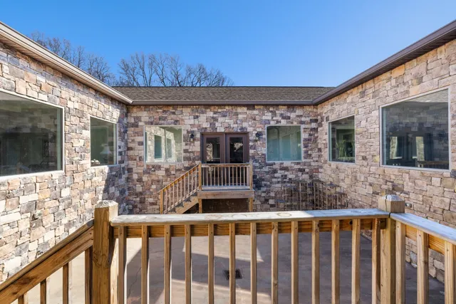 a view of a swimming pool with trees in the background
