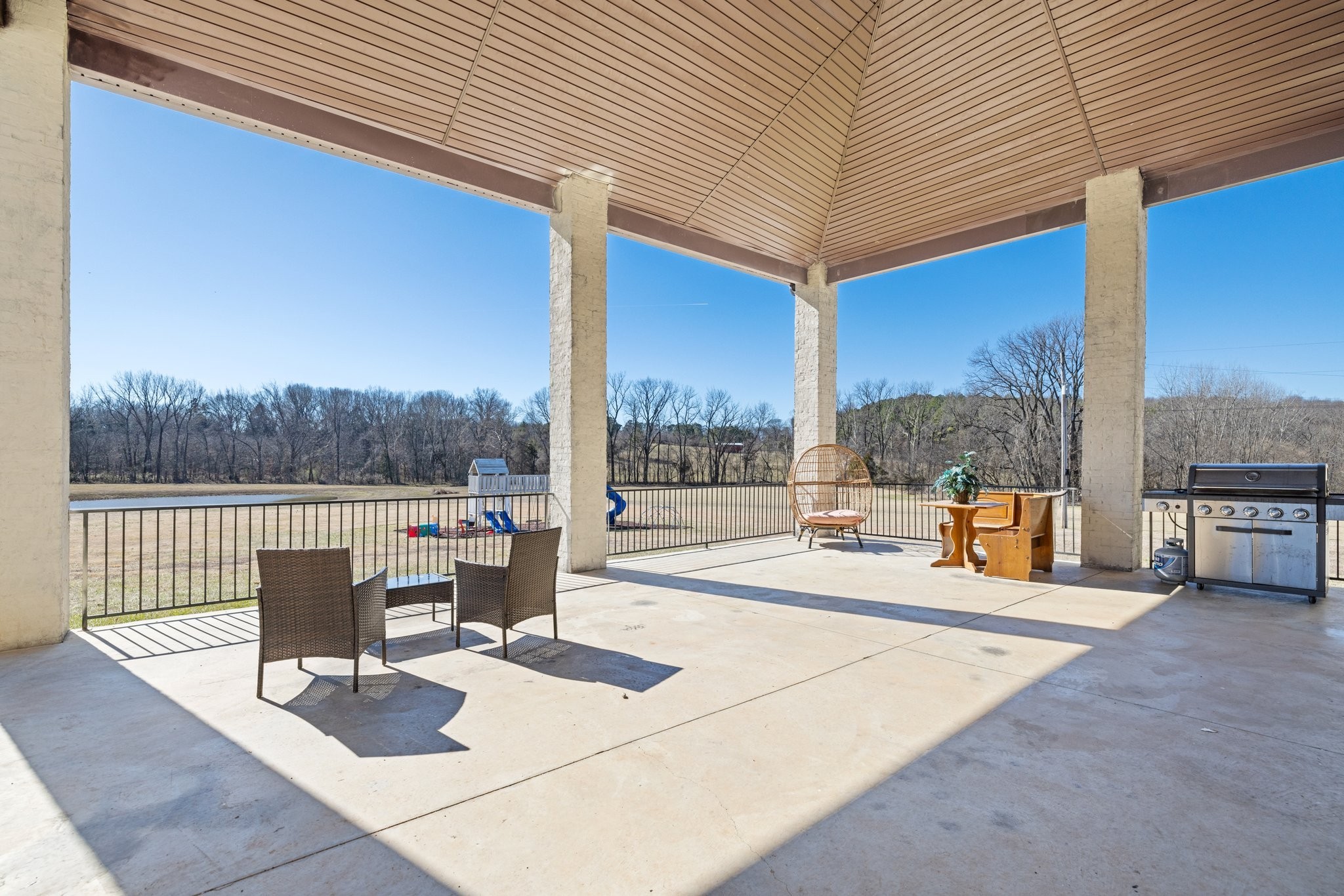 4785 Pulliam-Hardaway Road Springfield, TN 37172 - Photo 40 of 67 a view of a patio with a table and chairs and floor to ceiling window
