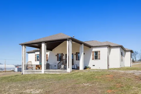an aerial view of residential houses with trees
