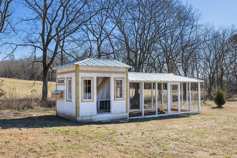 an aerial view of a house with a backyard space