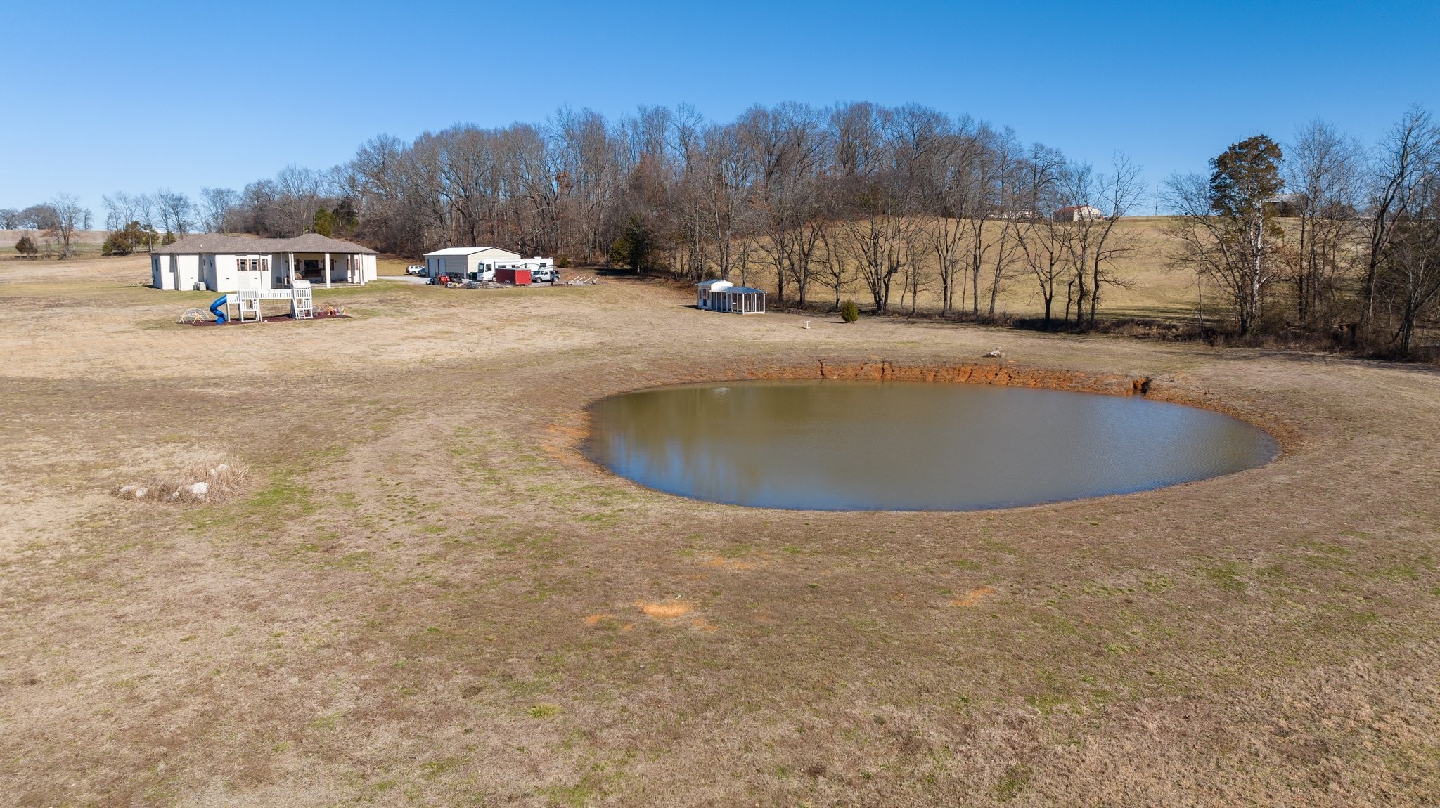 4785 Pulliam-Hardaway Road Springfield, TN 37172 - Photo 62 of 67 a view of a swimming pool with a yard and trees