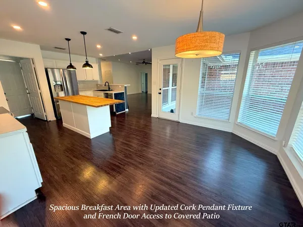 a view of kitchen with furniture and window