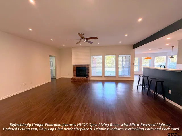 a view of livingroom with furniture window and wooden floor