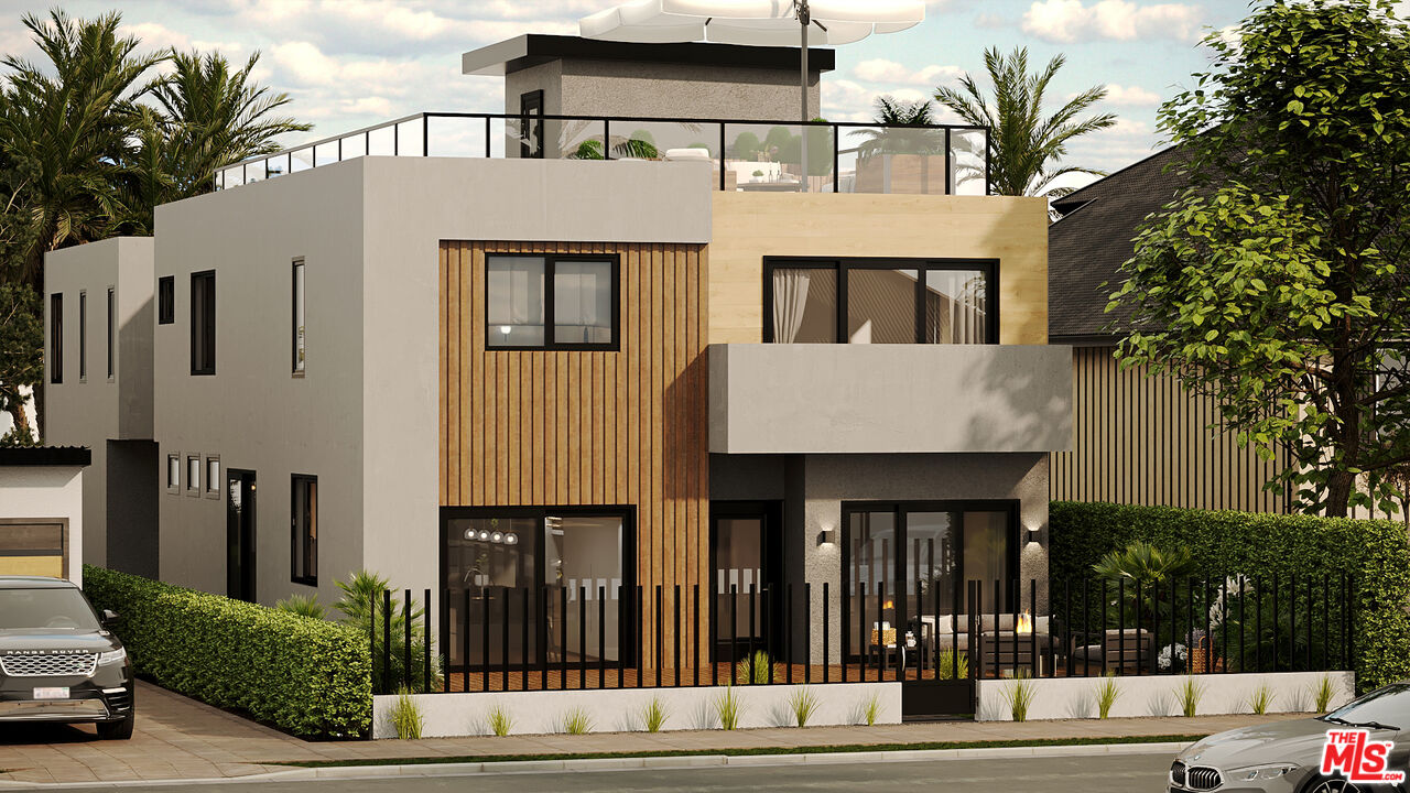 a front view of a house with glass windows and door