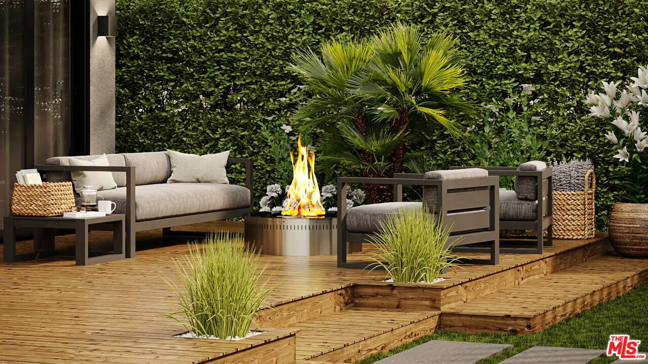 827 Dickson Street Marina del Rey, CA 90292 - Photo 15 of 18 a backyard of a house with table and chairs