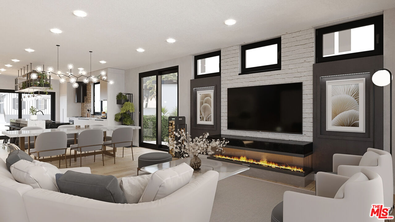 827 Dickson Street Marina del Rey, CA 90292 - Photo 2 of 18 a living room with fireplace furniture and a flat screen tv