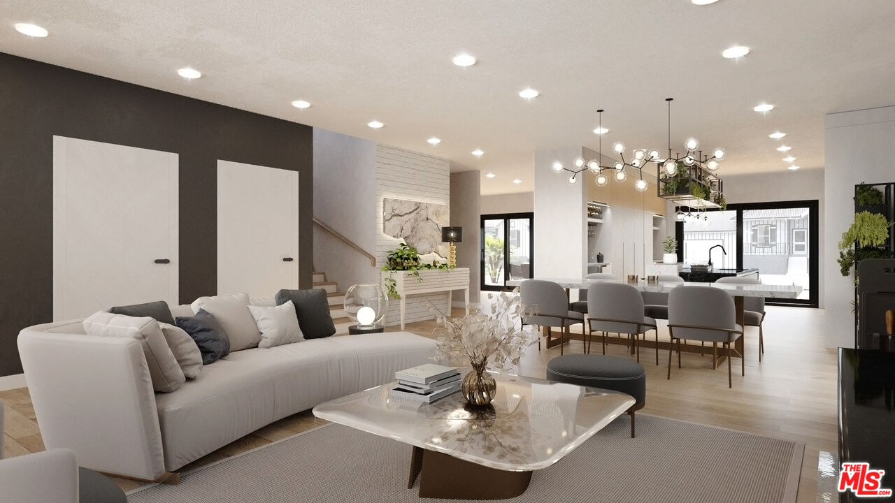 827 Dickson Street Marina del Rey, CA 90292 - Photo 3 of 18 a living room with fireplace furniture and a dining table