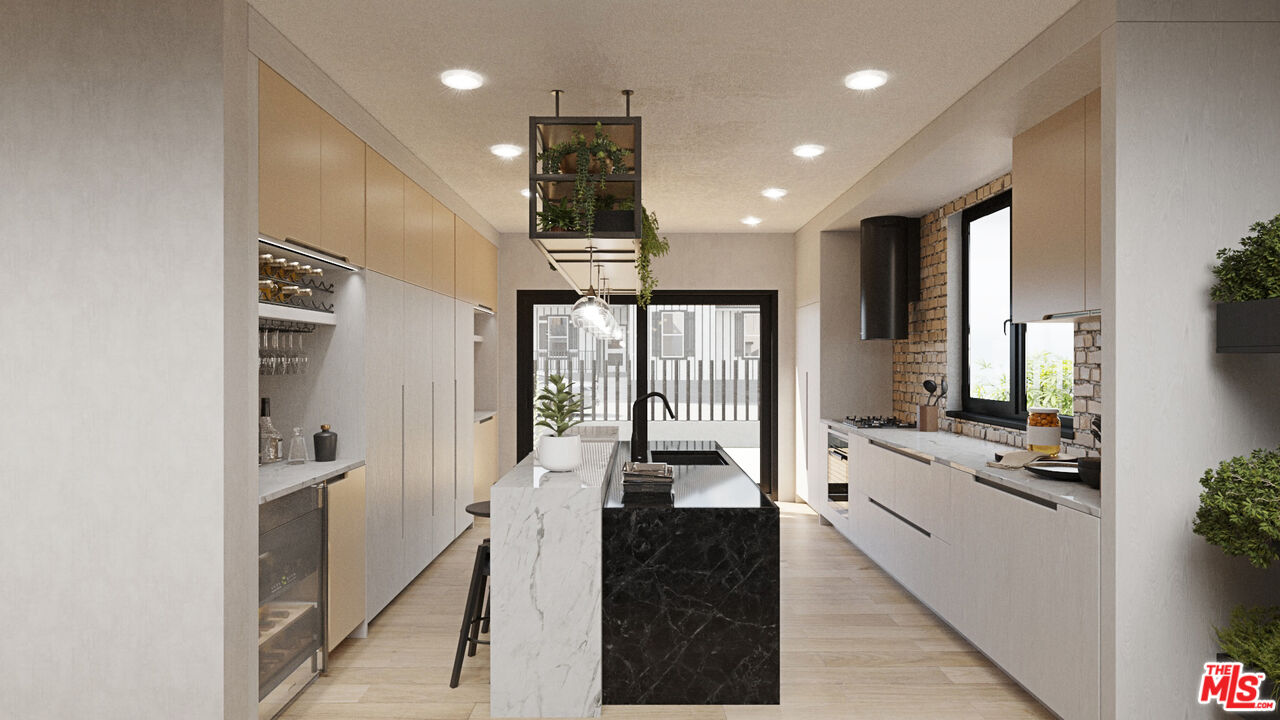 827 Dickson Street Marina del Rey, CA 90292 - Photo 5 of 18 a view of a kitchen with kitchen island granite countertop a large counter top appliances and cabinets