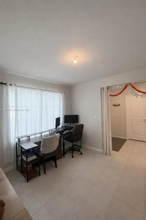 a bed room with furniture and a window