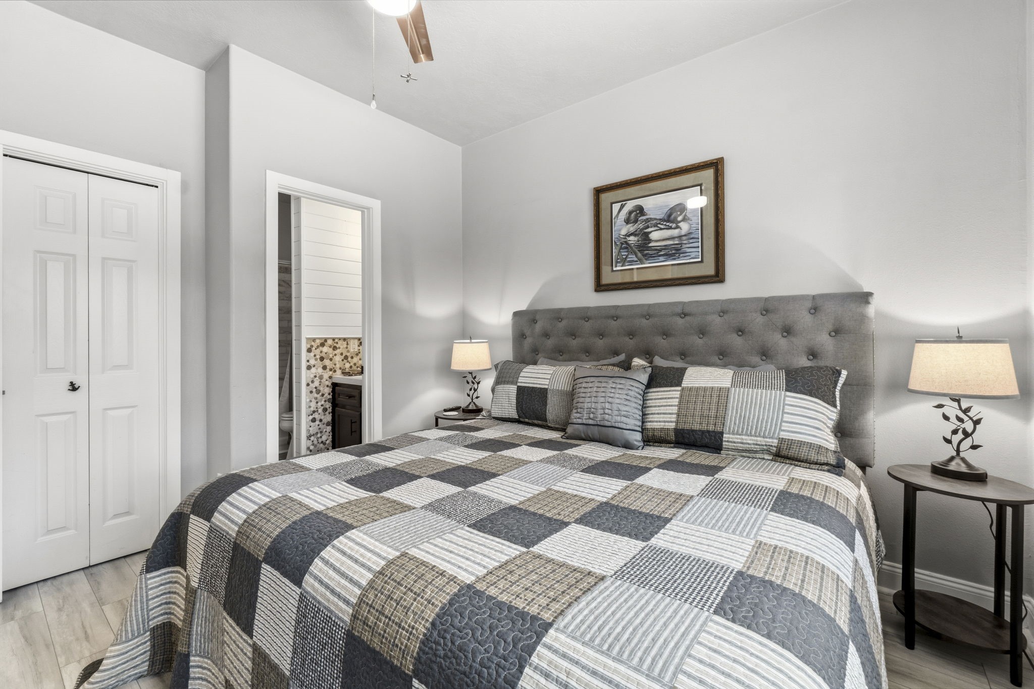 2 Key Harbour Conroe, TX 77356 - Photo 32 of 41 a bedroom with a bed and a lamp