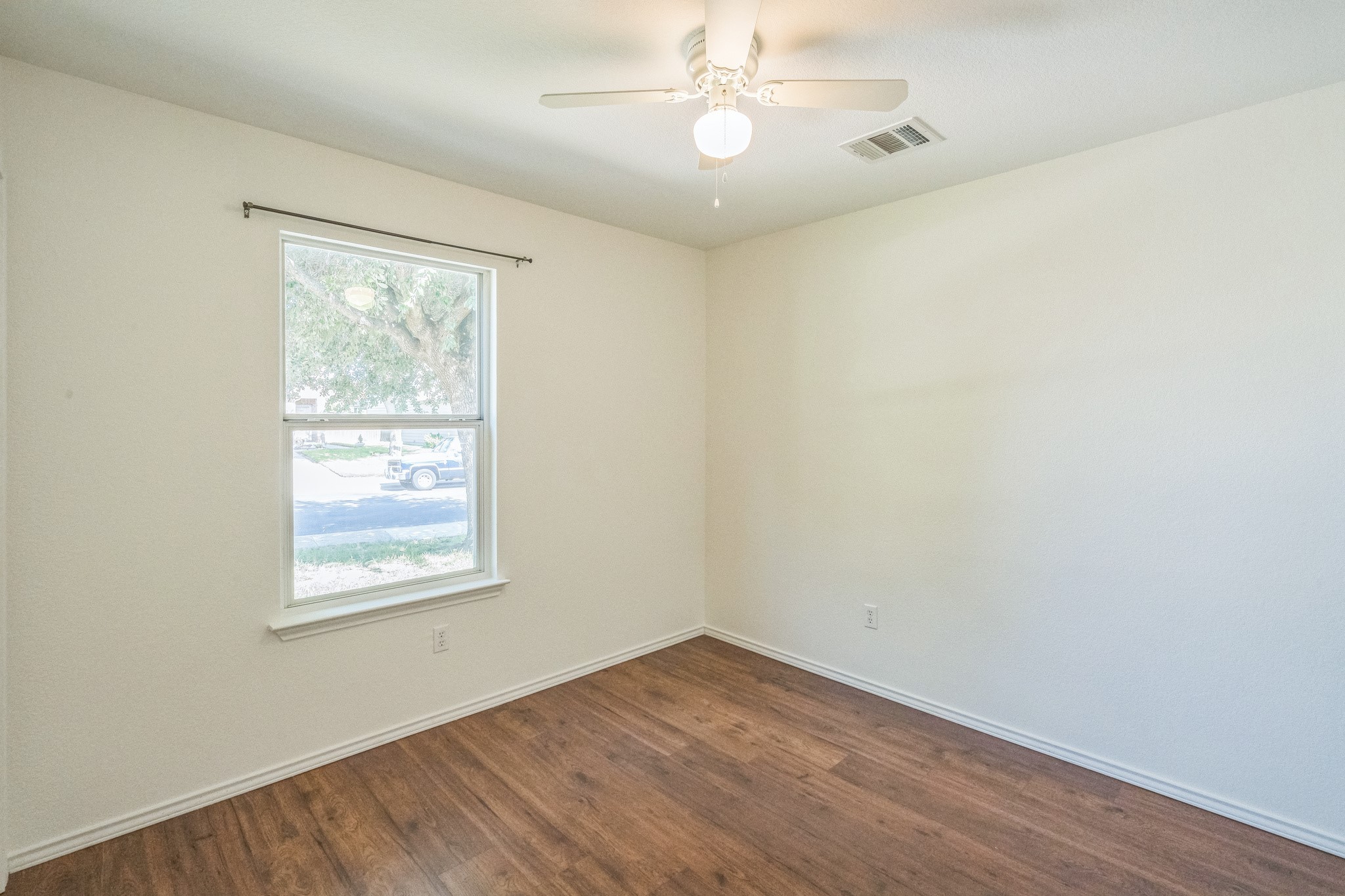 77 Jan Lane Georgetown, TX 78626 - Photo 5 of 16 Hardwood-style flooring and a window offering natural light complete this inviting space.