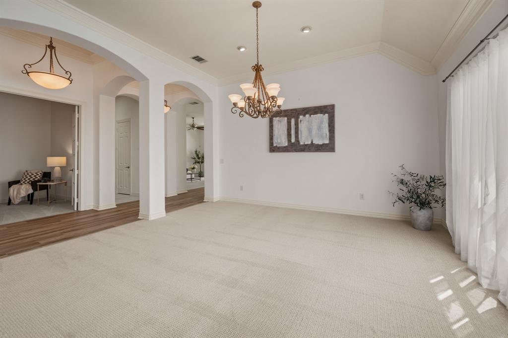 10605 Murray S Johnson Street Denton, TX 76207 - Photo 11 of 40 a view of a livingroom with a chandelier fan and windows