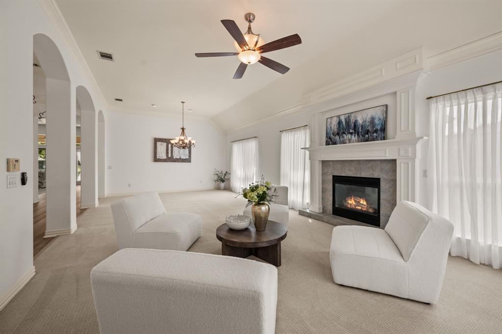10605 Murray S Johnson Street Denton, TX 76207 - Photo 12 of 40 a living room with furniture and a fireplace
