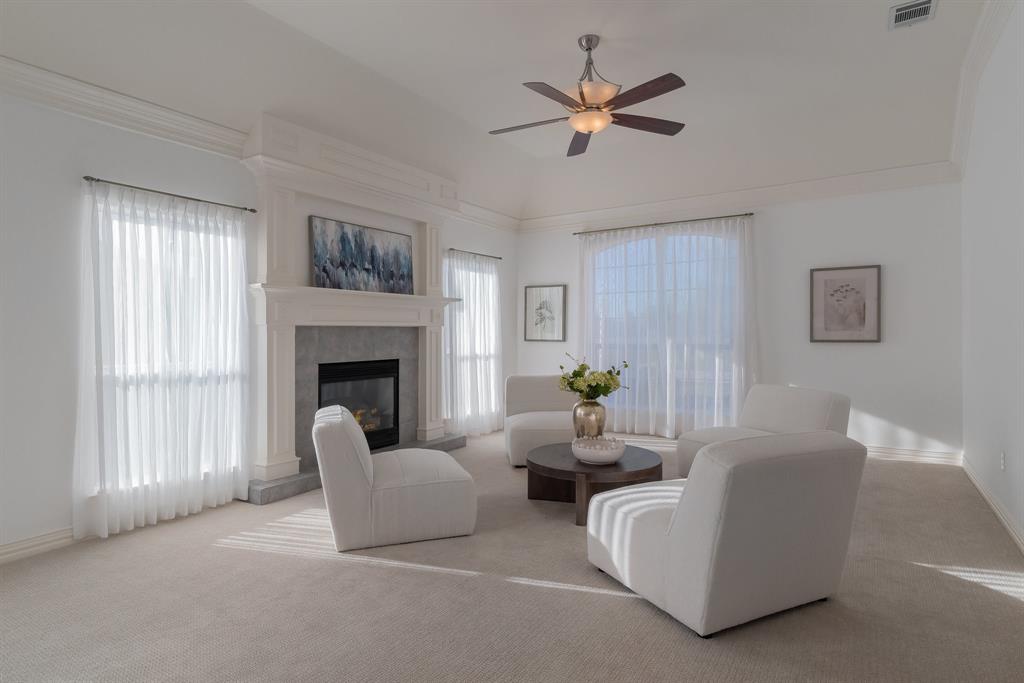 10605 Murray S Johnson Street Denton, TX 76207 - Photo 13 of 40 a living room with furniture and a fireplace