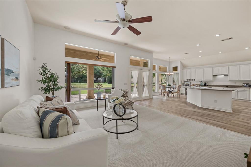 10605 Murray S Johnson Street Denton, TX 76207 - Photo 22 of 40 a living room with furniture a large window and white appliances