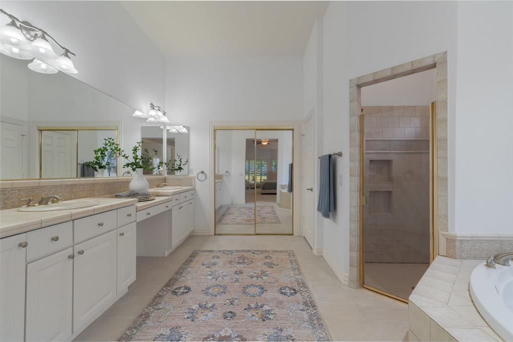 10605 Murray S Johnson Street Denton, TX 76207 - Photo 26 of 40 a bathroom with a sink a toilet and shower