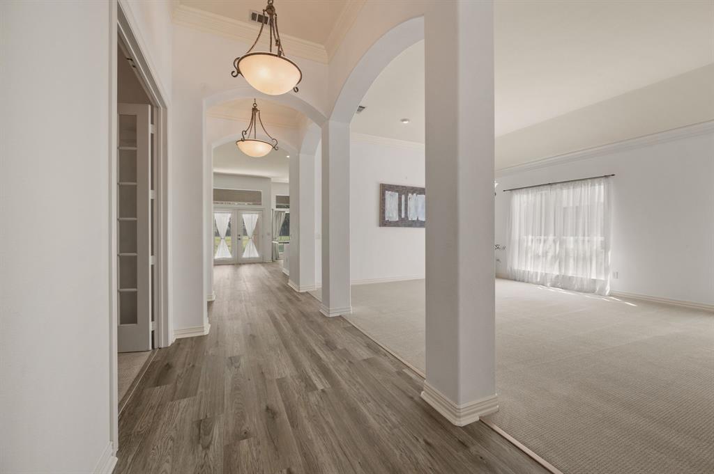 10605 Murray S Johnson Street Denton, TX 76207 - Photo 10 of 40 a view of hallway with wooden floor