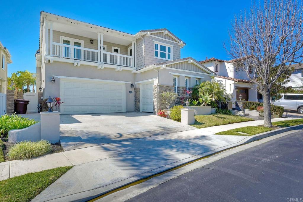 2606 Canto Rompeolas San Clemente, CA 92673 - Photo 17 of 18 a front view of a house with a yard and potted plants