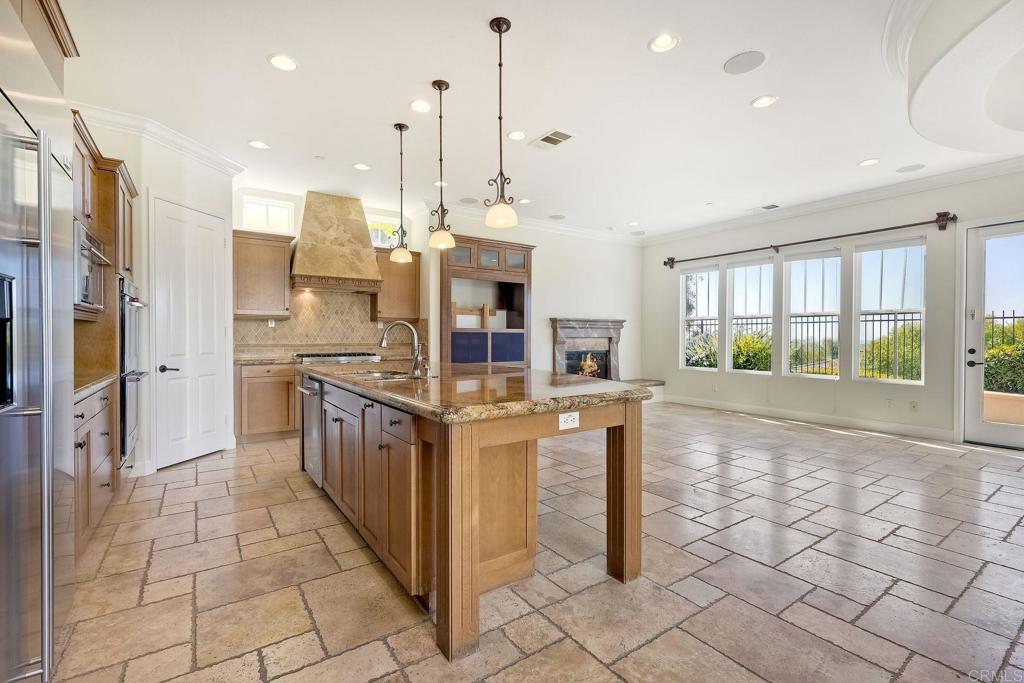 2606 Canto Rompeolas San Clemente, CA 92673 - Photo 6 of 18 a kitchen with stainless steel appliances granite countertop a stove and a refrigerator