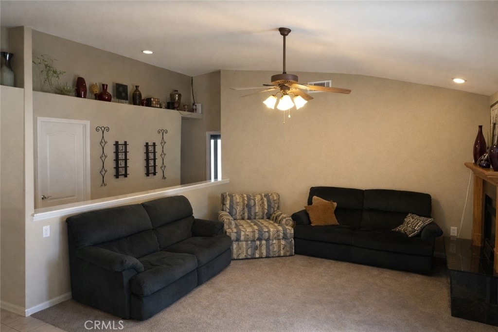 19095 Glenwood Avenue Riverside, CA 92508 - Photo 7 of 14 a living room with furniture and a chandelier