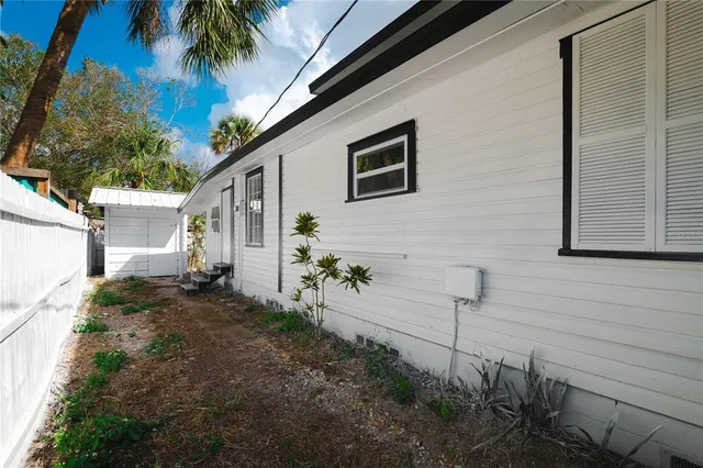 a view of a backyard with plants