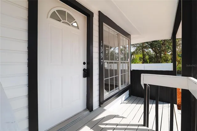 a view of a balcony with wooden floor