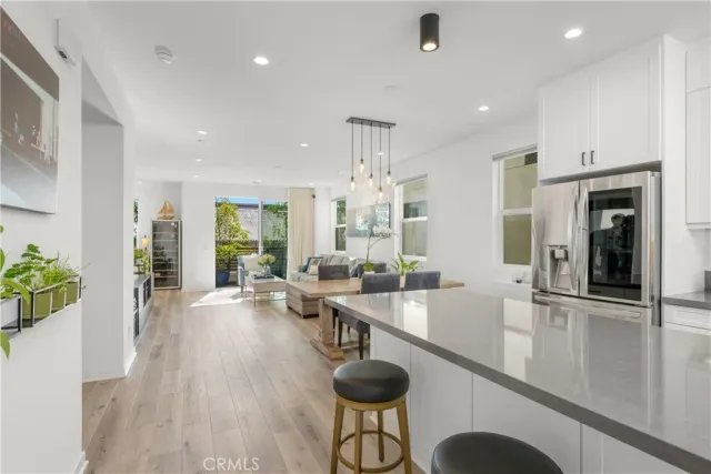 a kitchen with counter top space and windows