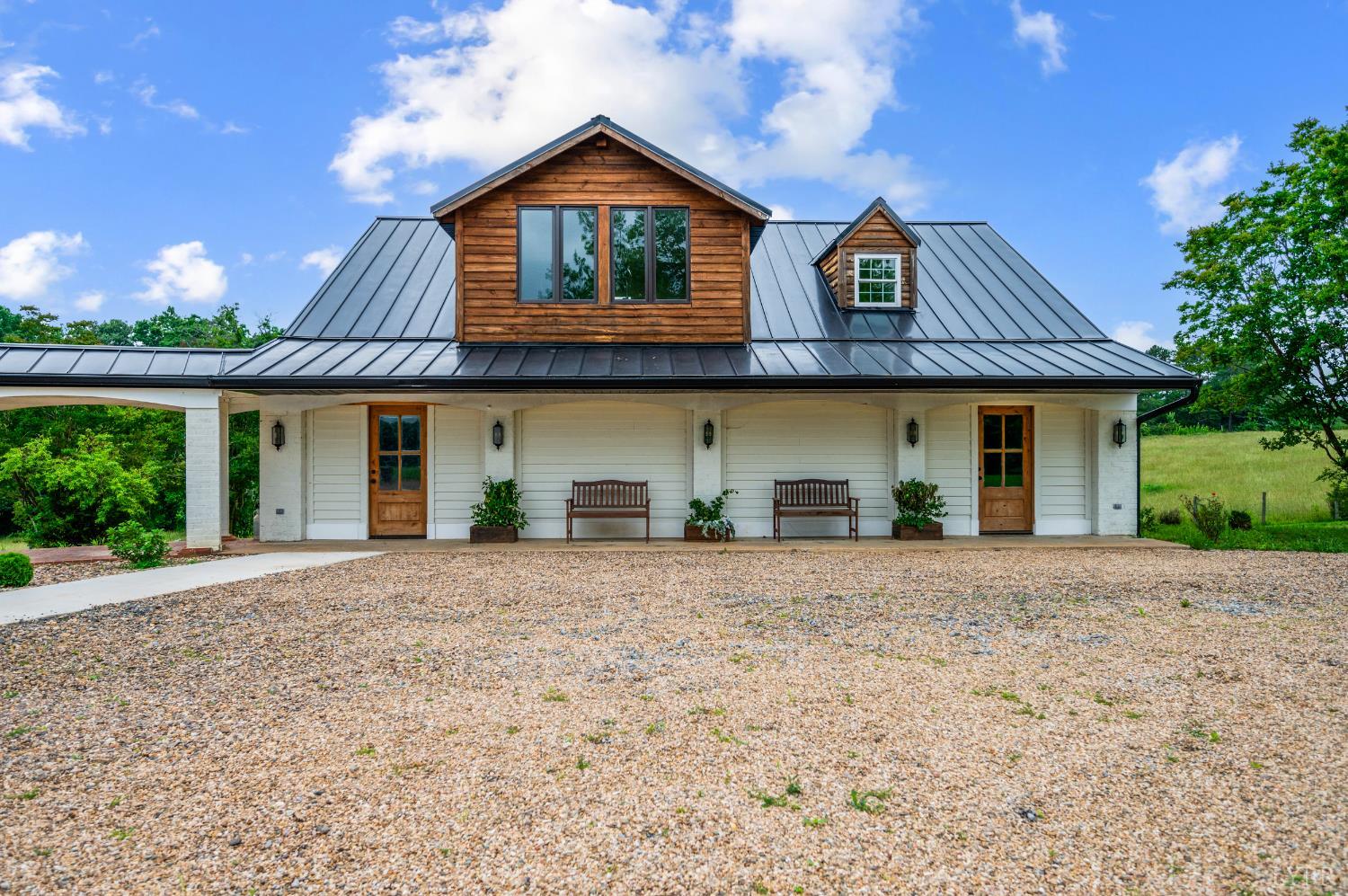 7845 Bear Creek Road Gladys, VA 24554 - Photo 14 of 99 a front view of a house with a yard and garage