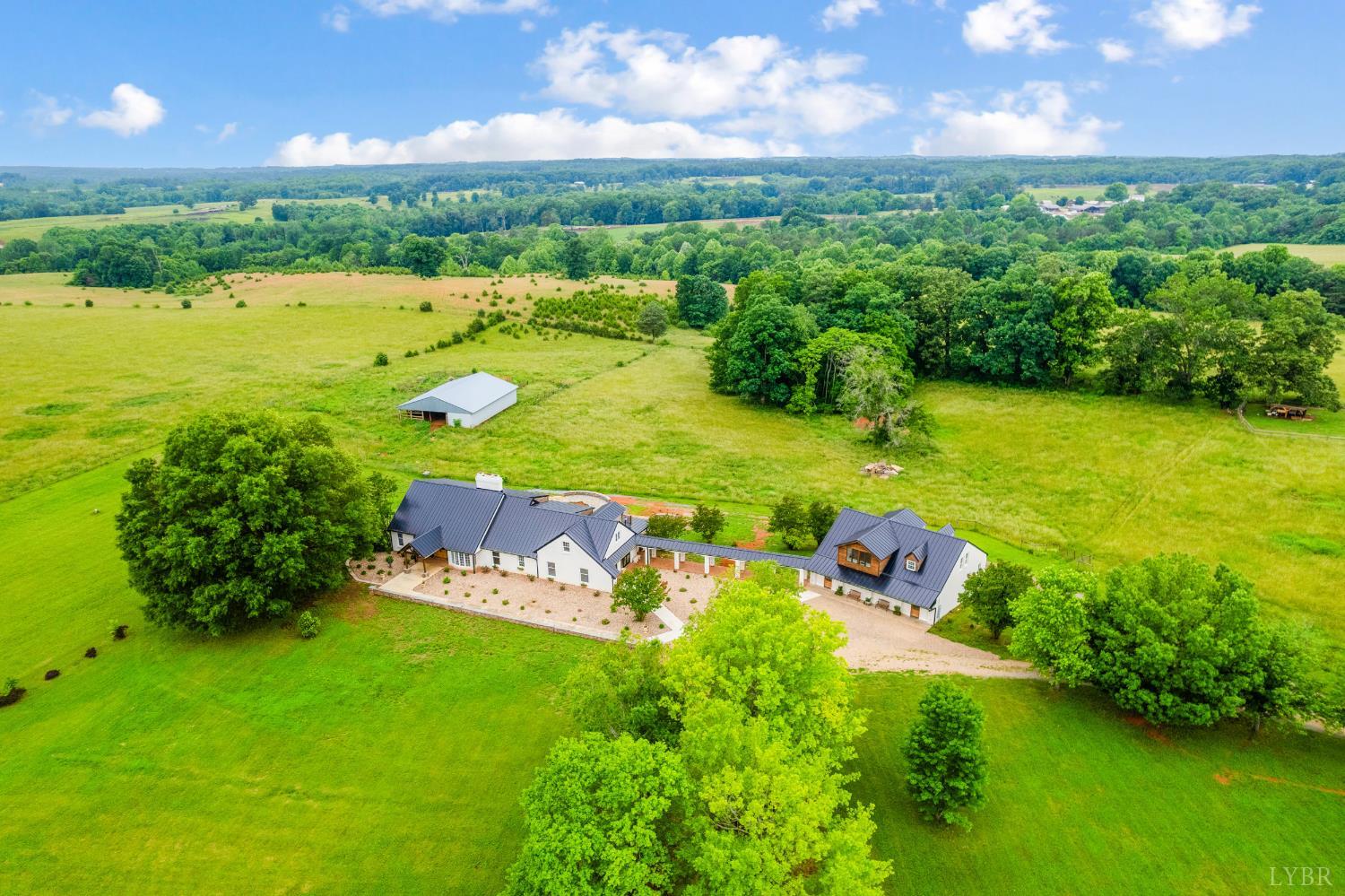 7845 Bear Creek Road Gladys, VA 24554 - Photo 2 of 99 an aerial view of a house with a yard basket ball court and outdoor seating