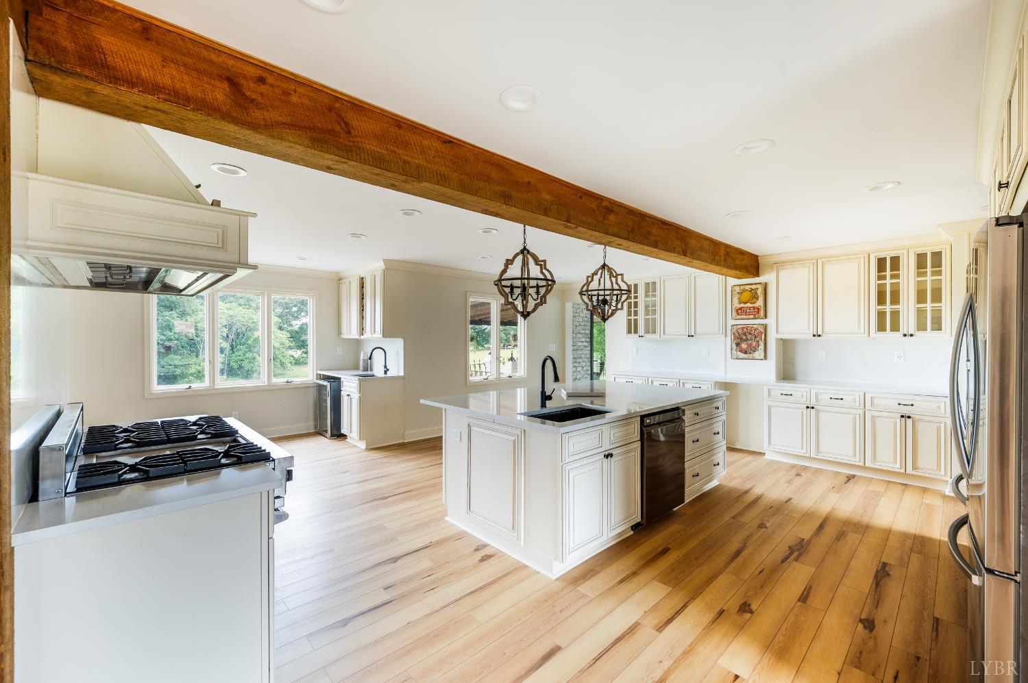 7845 Bear Creek Road Gladys, VA 24554 - Photo 39 of 99 a kitchen with stainless steel appliances granite countertop a stove and cabinets with wooden floor